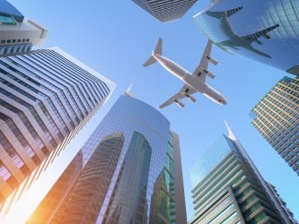 Airplane flying over skyscrapers n city downtown district. Business corporate travel background concept. 3d illustration